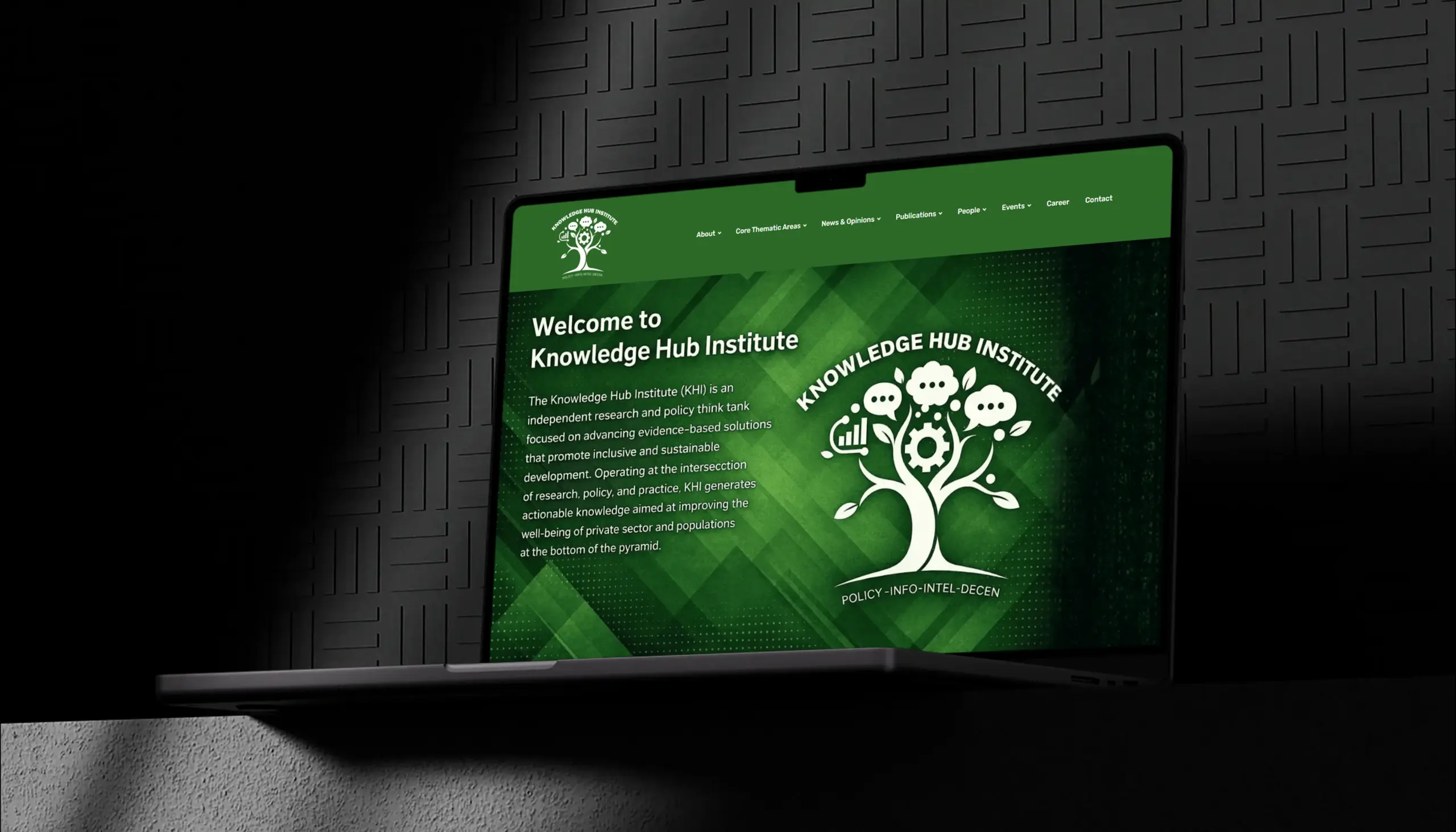 Knowledge Hub Institute WordPress website homepage shown on laptop with policy research sections